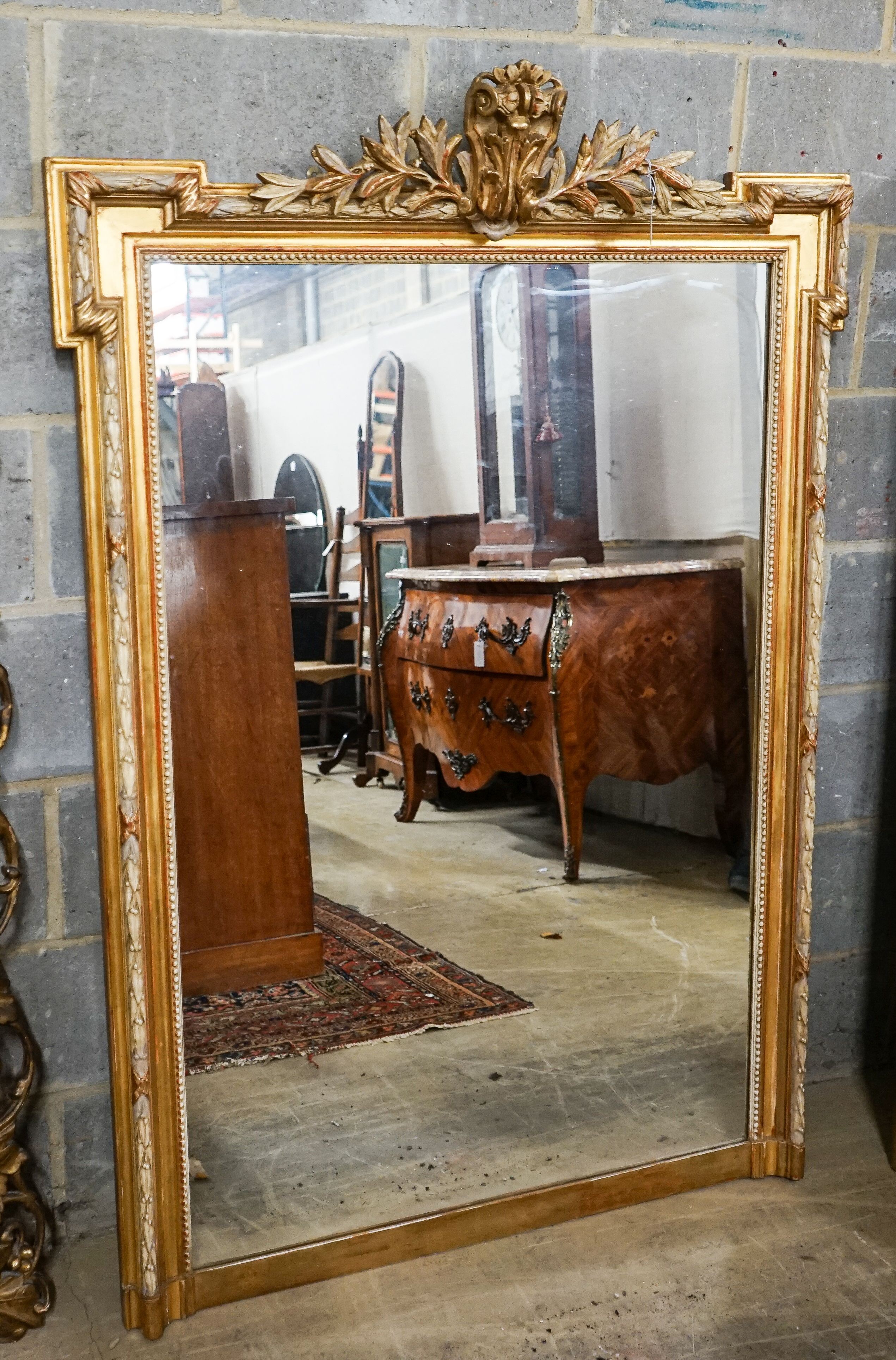 A large Victorian style rectangular carved giltwood overmantel mirror, width 109cm, height 156cm